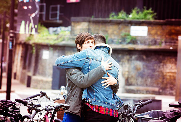 Urban Hug Stock Photo - Download Image Now - Embracing, Street, Forgiveness  - iStock