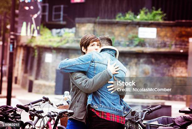 Urban Hug Stock Photo - Download Image Now - Forgiveness, Embracing, Sadness