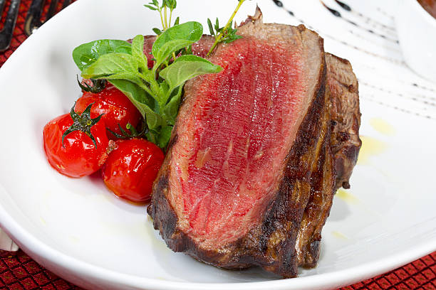 istock Medium Grilled bbq steaks and savory tomato sauce 519362525