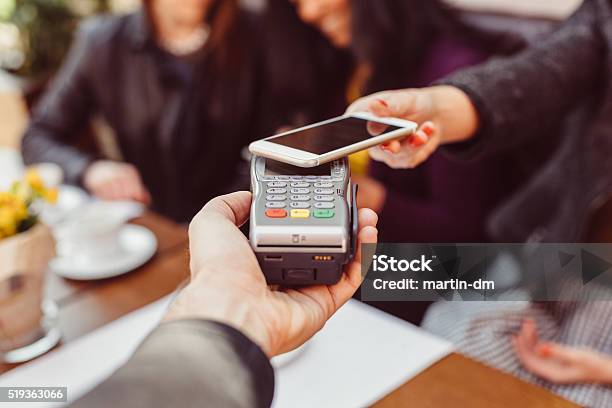Woman Making Contactless Payment With Smartphone Stock Photo - Download Image Now - Paying, Mobile Phone, Digital Wallet