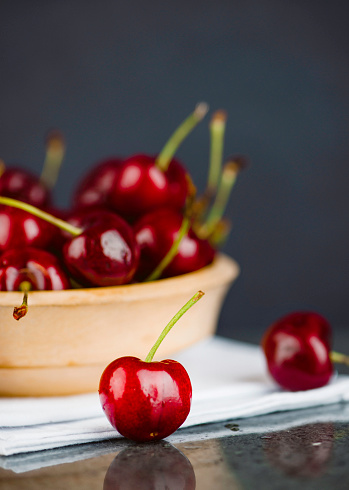 Fresh Organic Cherries in Wooden Bowl