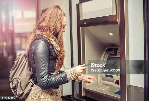 Young Woman Taking Money From Atm Stock Photo - Download Image Now - Student, Bank Account, Banking