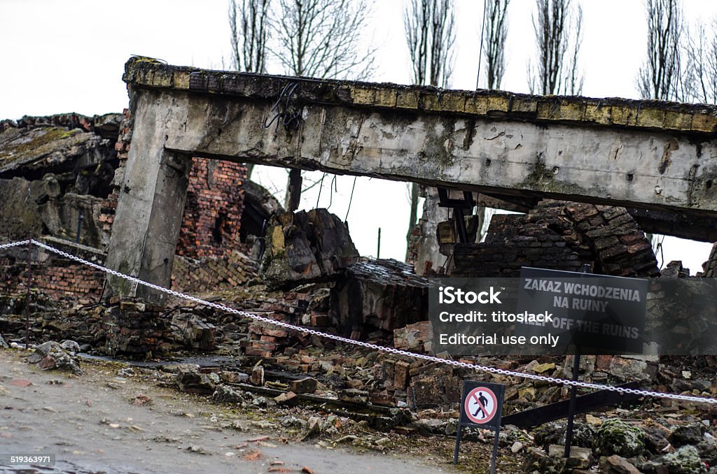 Ruins of a Auschwitz II / Birkenau Gas Chamber Oswiecim, Poland - March 17, 2014: Ruins of a gas chamber at Auschwitz II / Birkenau in Poland. The gas chambers were destroyed by the fleeing Nazis in the Autumn of 1944 as the Allied liberated Poland. Torture Stock Photo