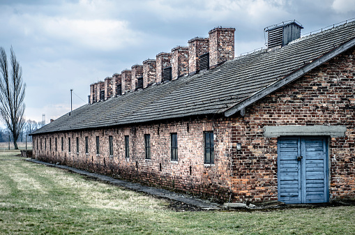 Oswiecim, Poland - March 17, 2014: Original brick barracks at the Auschwitz II / Birkenau concentration camp in Oswiecim, Poland.