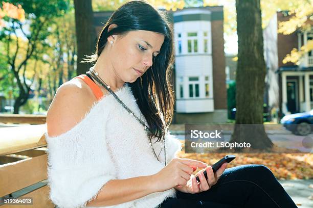 Autumne Woman Cellphone Park Stock Photo - Download Image Now - Adult, Horizontal, Mobile Phone