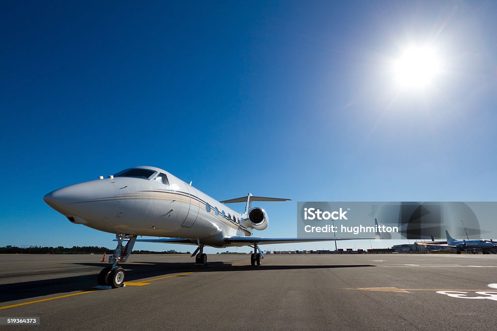 Jet Awaits a Gulfstream private jet sits parked on the airport apron on a business visit Corporate Jet Stock Photo