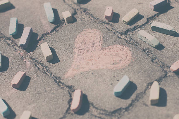 istock Heart shape, pieces of chalk on the sidewalk 519367224