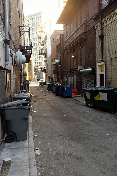 Filthy urban alley. Nobody. Vertical.