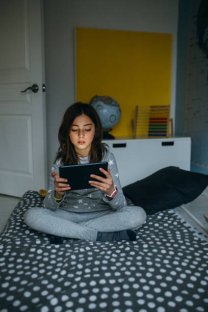 istock Girl with tablet 519369776