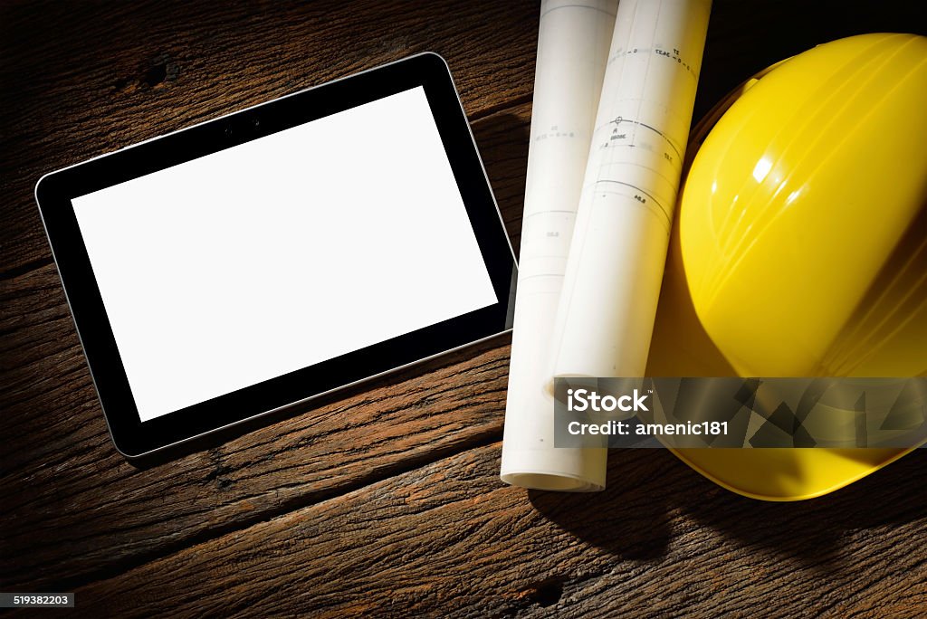 Tablet computer Tablet computer with architecture and construction tools and blueprints Architect Stock Photo