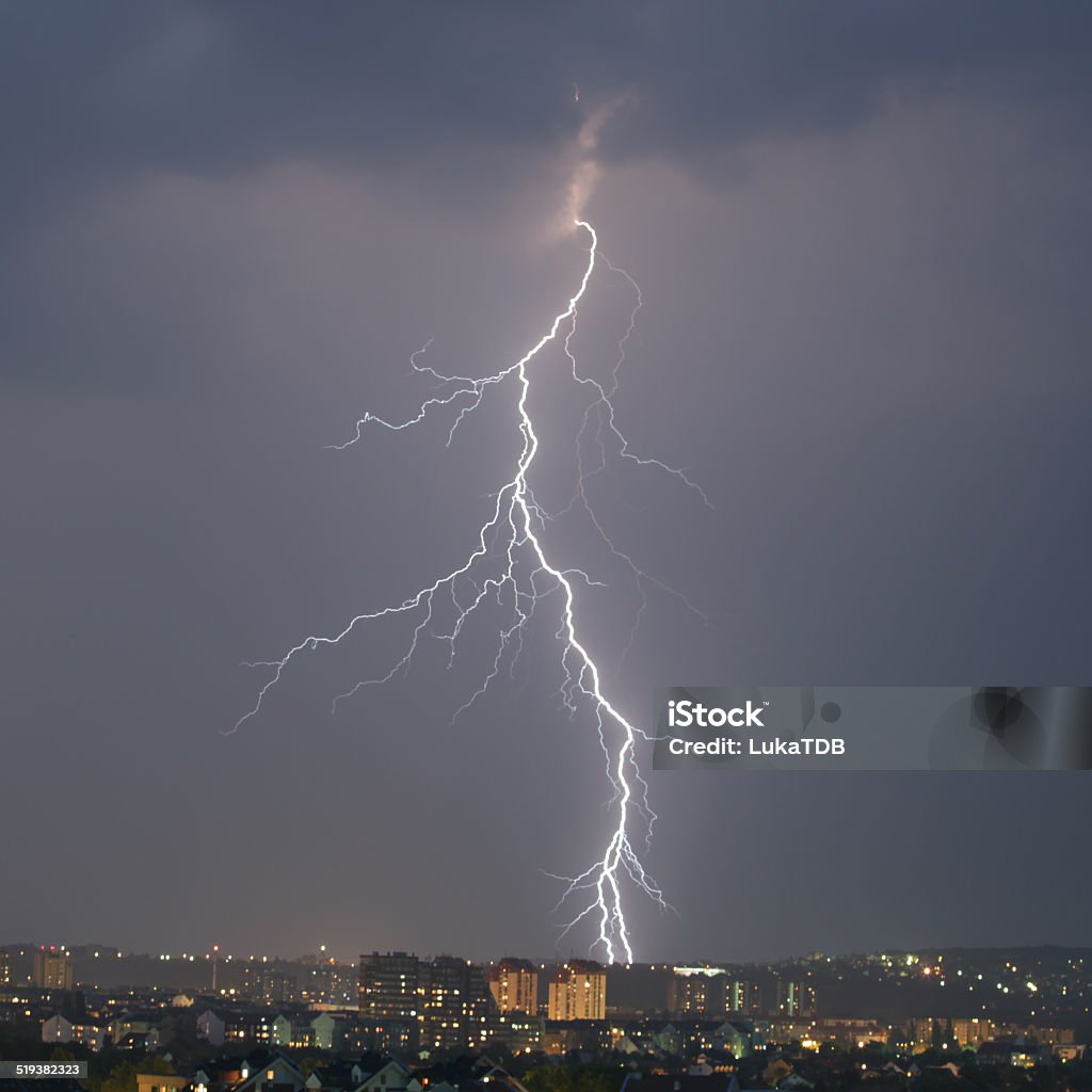Lightning strike over night city Bolt - Fastener Stock Photo