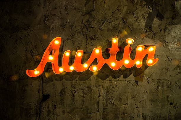 istock Austin Light Up Metal Sign Hanging on Textured Wall 519384395