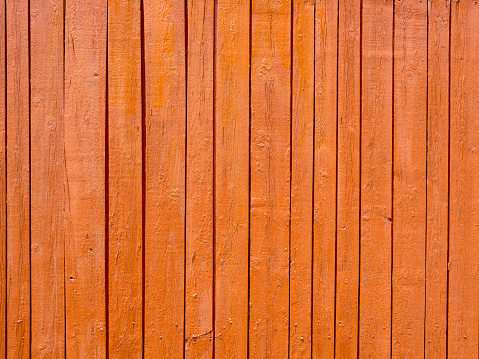 Section of an old brown wooden wall.