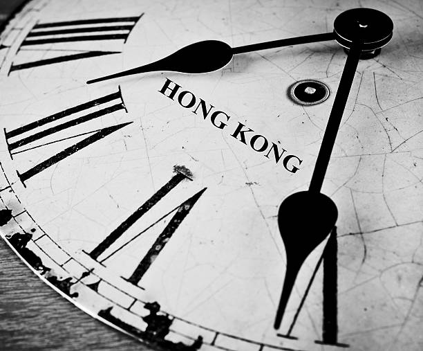 istock Hong Kong black and white clock face 519387157
