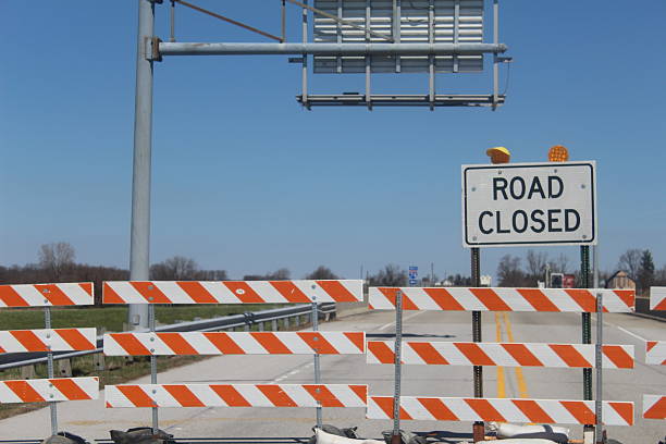 istock Signs for Road Closed over bridge 519387192