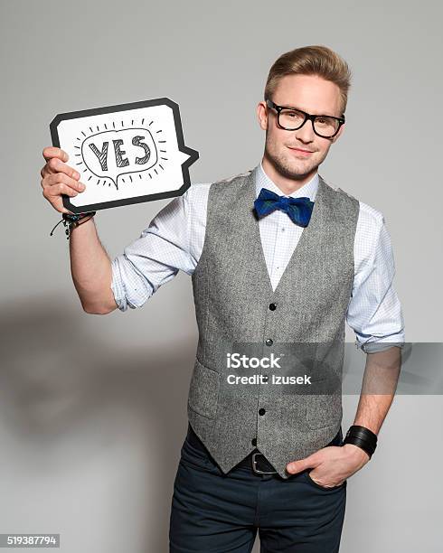 Fashionable Blonde Young Man Wearing Tweed Vest And Bow Tie Stock Photo - Download Image Now