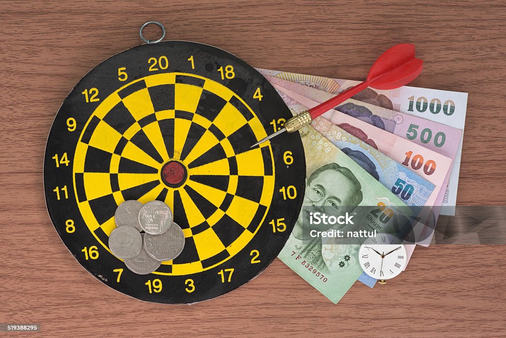Dart, target, clock, and Money Dart, target, clock, and Thai Baht Money Accuracy Stock Photo