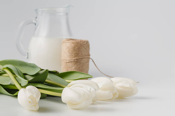 istock Gift with natural packaging and a white tulips 519390870