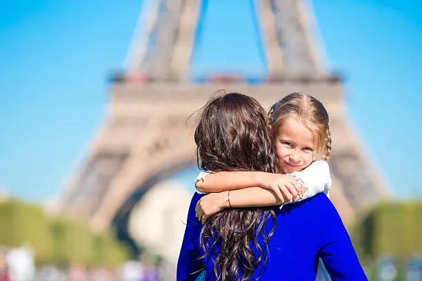 Photo of Happy mother and little adorable girl have fun in Paris