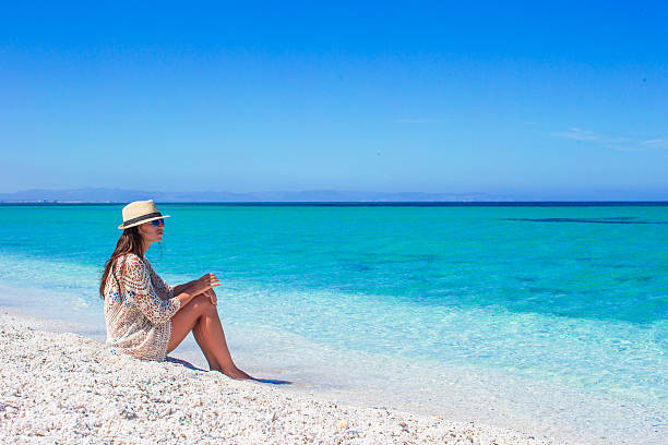 istock Young beautiful woman enjoying beach tropical vacation 519393780