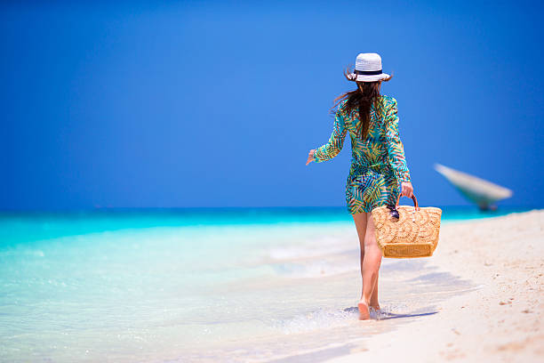 istock Young beautiful woman on beach vacation 519394938
