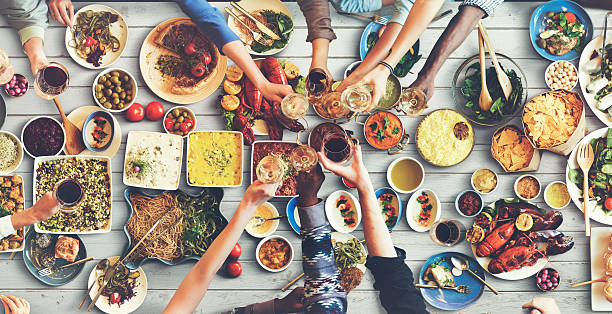 istock Friends Happiness Enjoying Dinning Eating Concept 519395762