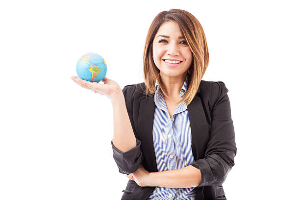 istock Pretty Hispanic businesswoman with a globe 519397002
