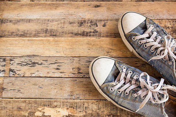 istock Old shoes on wooden floor 519398548