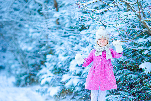 istock Cute little girl with flashlight having fun in winter day 519398766