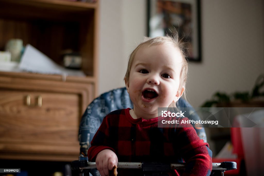 baby boy enjoys eating cookie He's so cute with a cookie! 12-23 Months Stock Photo