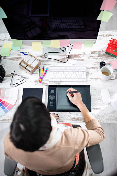 istock woman designer writing on the pen table 519400950
