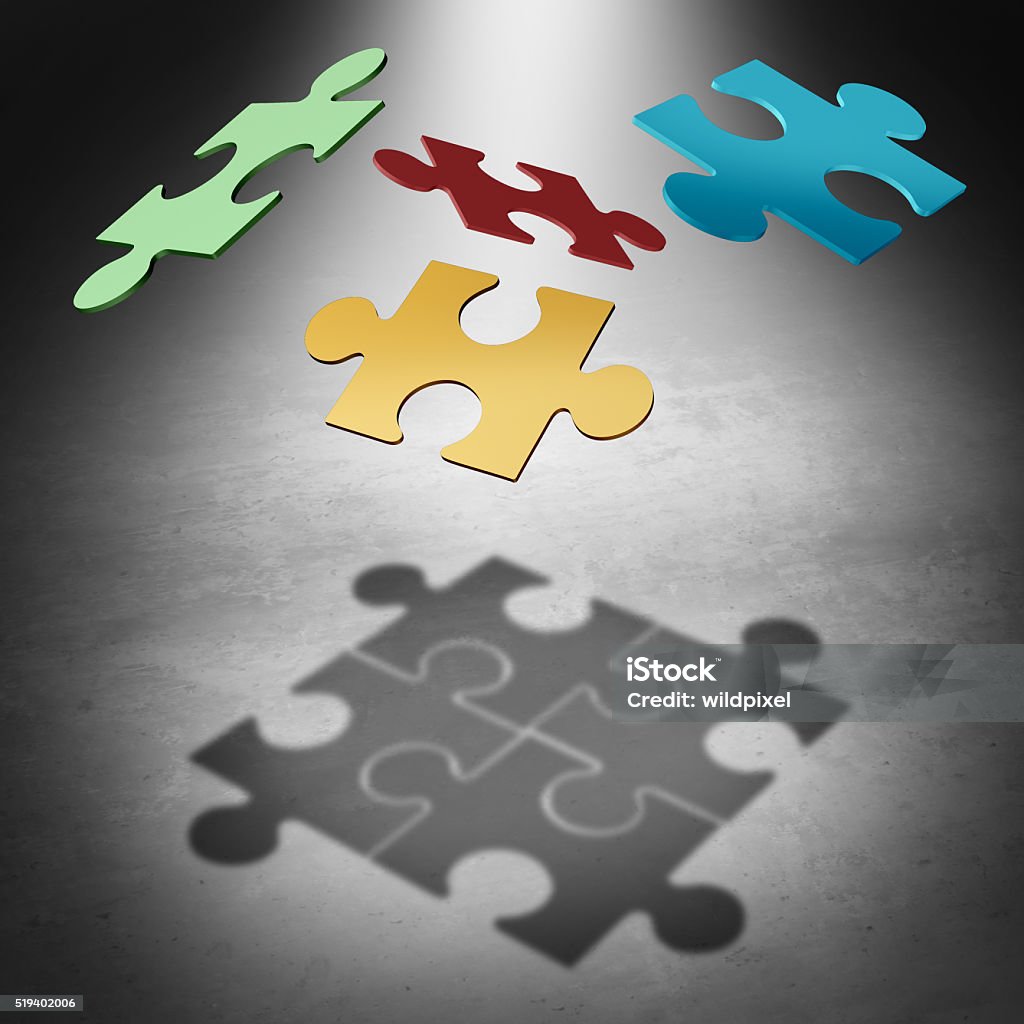 Putting The Puzzle Together Putting the puzzle together teamwork concept as a business success symbol with four divided pieces of a jigsaw puzzle flying in the air creating a cast shadow that unifies the team as a unity metaphor. Abstract Stock Photo