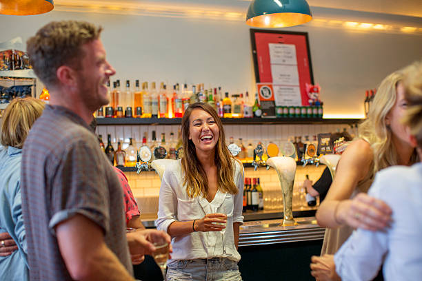 istock Group of friends at a bar having a drink 519402094