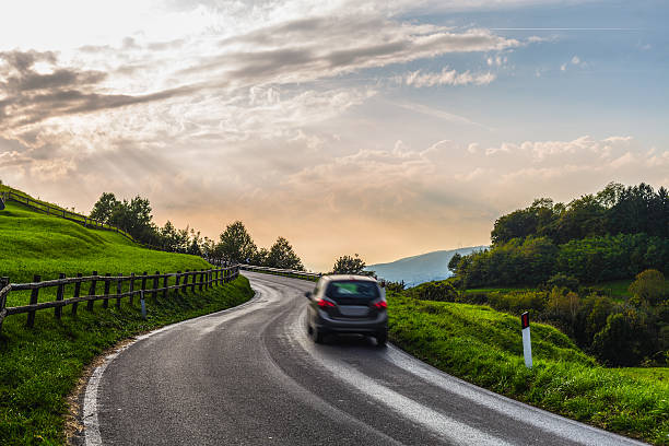 istock Car through a country road 519403889