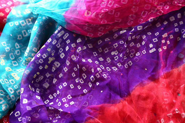 istock Indian bandhej saree cloth fabric texture 519404123