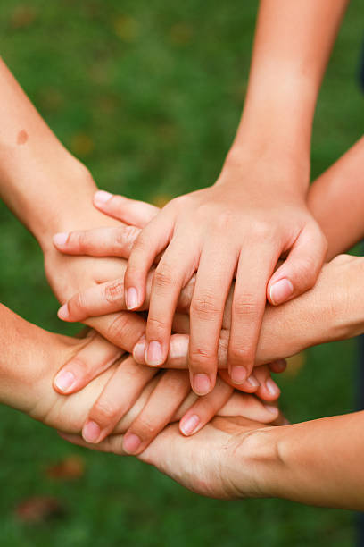 istock Group of people holding hand together 519404167