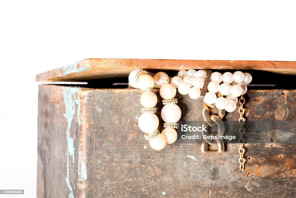 Old Crate with jewels Old Crate with jewels isolated on a white background Antique Stock Photo