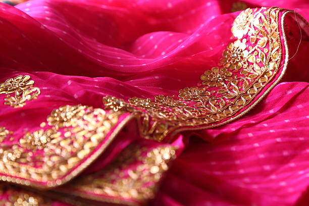 istock Indian bandhej saree cloth fabric texture 519405095