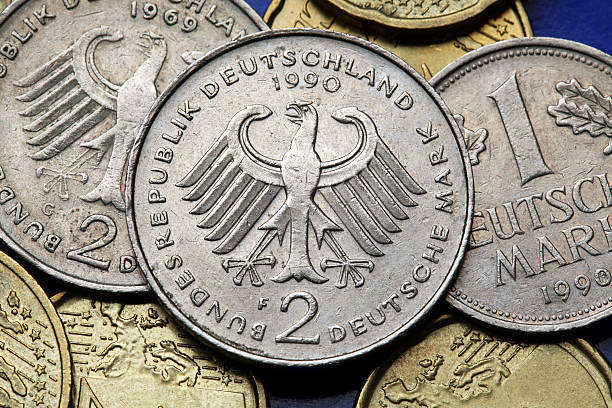 Coins of Germany Coins of Germany. German eagle depicted in old Deutsche Mark coins. aquila heliaca stock pictures, royalty-free photos & images