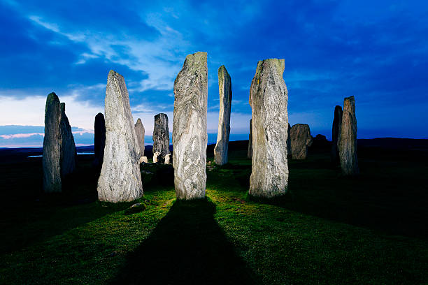 The ancient stone circle at Callanish on the Isle of Lewis in the Outer Hebrides of Scotland just before dawn. The stones are of Lewisian gneiss and stand from two to almost five metres high, forming a near circle about eleven metres in diameter. Little is known of the neolithic builders who erected the stones between 2600BC and 2900BC, but a solitary visit to the site before the sun rises will stir feelings of mystery and wonder amongst even the most secular of minds. AdobeRGB colorspace.