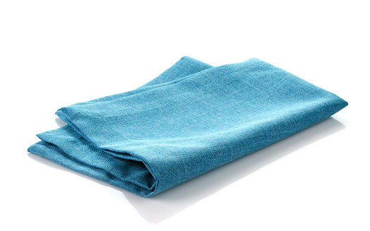 blue folded cotton napkin on a white background