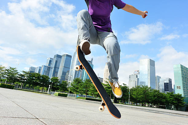 istock skateboarding woman jumping 519409077