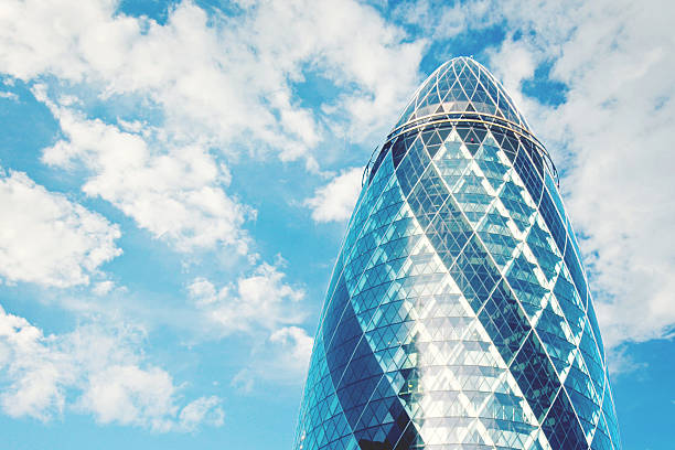 30 St Mary Axe,  knownas the Gherkin and previously as the Swiss Re Building is a commercial skyscraper in London's  financial district. It was designed by Norman Foster and Arup Group. The building has become an iconic symbol of London and is one of the city's most widely recognised examples of contemporary architecture.