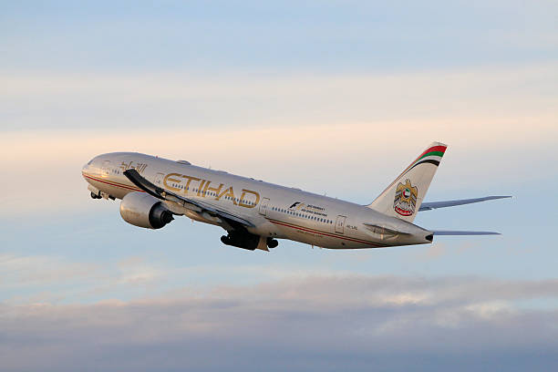 Etihad Airways Boeing 777-200LR taking off at LAX Airport stock photo