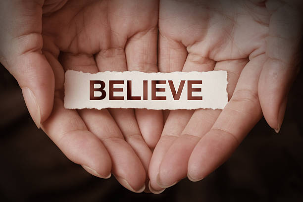 Believe text on hand Believe text on hand design concept worshipper photos stock pictures, royalty-free photos & images