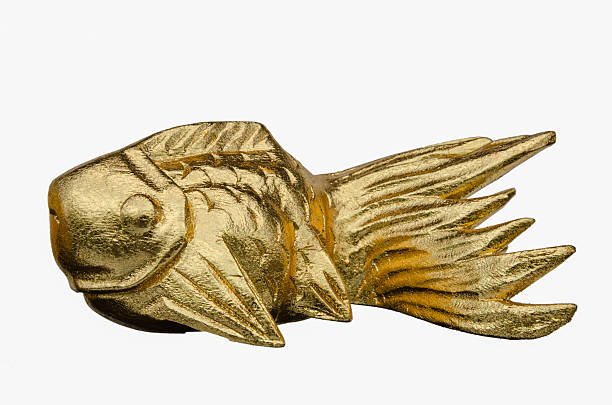 istock Wooden carved goldfish on white background 519422588