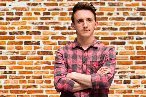 istock Casual man standing with arms crossed 519422836