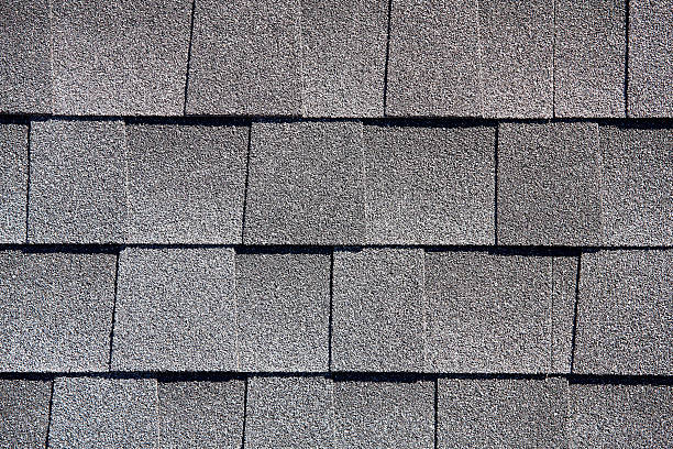 Roofing Shingles gray sand shake tab style pattern Roofing Shingles gray sand shake tab style pattern sample for building industryRoofing Shingles wood shake tab style pattern sample for building industry wood shingle photos stock pictures, royalty-free photos & images