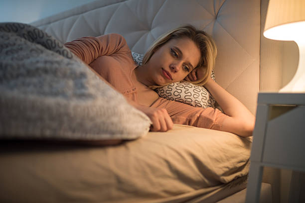 istock Young pensive woman feeling lonely in bed. 519428452