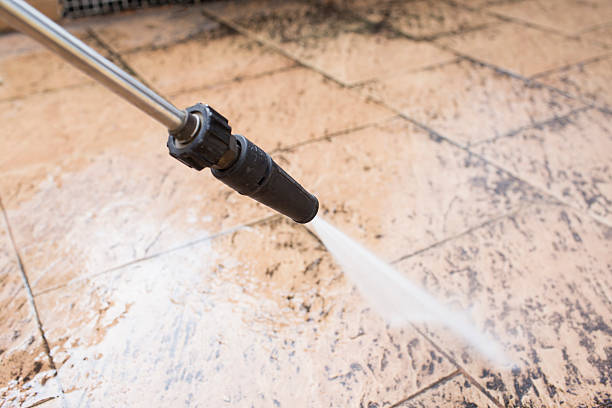 istock outdoor floor cleaning with high pressure water 519430244